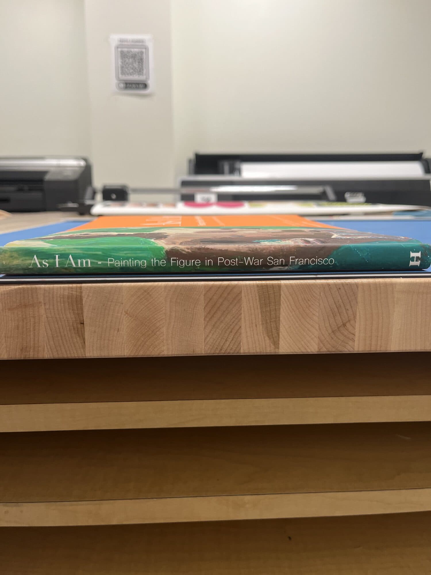 The spine at eye level on the print shop bench