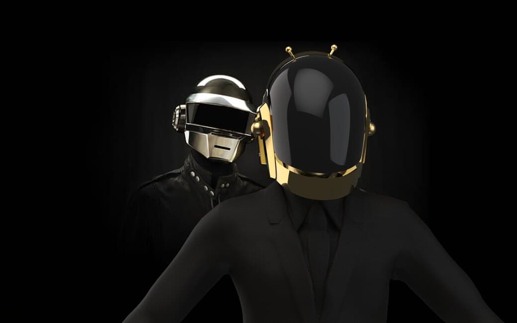 Both helmets, silver and gold, lit against black